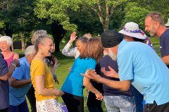 Group of people laughing with one another