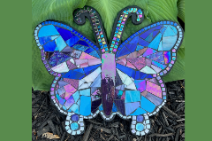 Picture of a butterfly mosaic with blue and purple pieces of glass