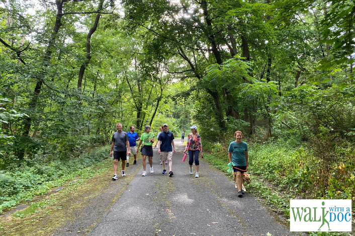 Multiple people walking on the capital area greenbelt