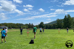 People playing disc golf