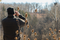 Man looking through binoculears