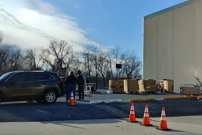 Car backing up at a recycling center